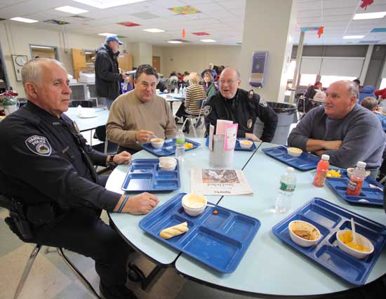 From left, Detective Jack Izzo, DPW Director Rich Nota, Officer Greg Newman, and DPW employee Bill Card take a break from their duties to eat lunch at the shelter. From left, Detective Jack Izzo, DPW Director Rich Nota, Officer Greg Newman, and DPW employee Bill Card take a break from their duties to eat lunch at the shelter.