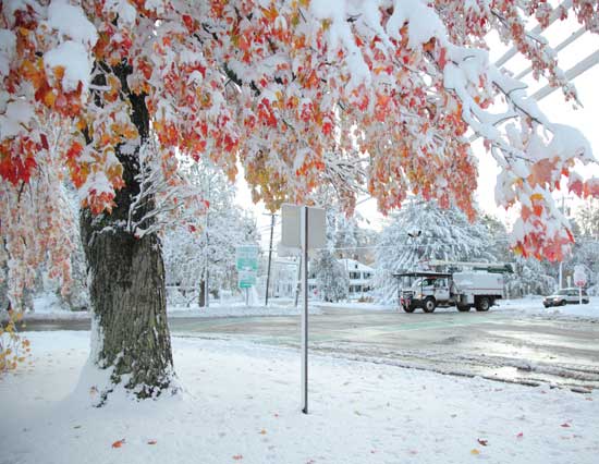 A utility truck drives through the center early on Sunday morning, Oct. 30. 