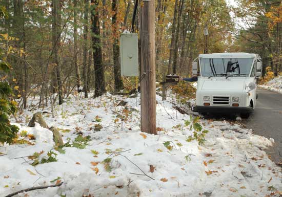 A mail carrier on South Shaker Road proves “Neither snow nor rain nor heat nor gloom of night stays these couriers from the swift completion of their appointed rounds." A mail carrier on South Shaker Road proves “Neither snow nor rain nor heat nor gloom of night stays these couriers from the swift completion of their appointed rounds."