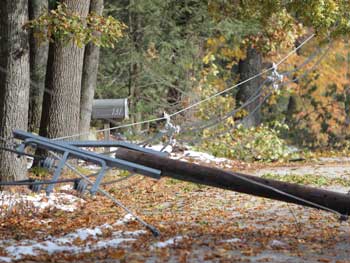 Three-phase power lines lie on Slough Road at Bolton Road, making the road impassable. (Photo by Lisa Aciukewicz) 