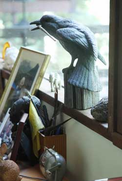 A crow sculpture above Coleman’s desk holds a paintbrush at the ready. (Photo by Lisa Aciukewicz) A crow sculpture above Coleman’s desk holds a paintbrush at the ready. (Photo by Lisa Aciukewicz)