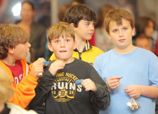 From left: Nico Agosta, Dimitri Dutkewych, and Shane Bilodeau check their tickets. From left: Nico Agosta, Dimitri Dutkewych, and Shane Bilodeau check their tickets.