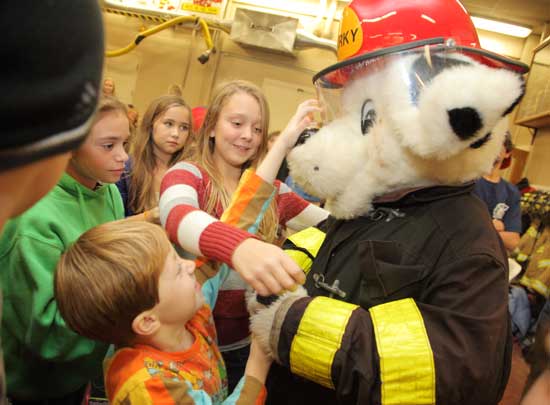 From left: Leila Grant, Kian Oldham, Madison Drummey, and Ava Scully gather around Sparky the Fire Dog (Billy Nigzus). From left: Leila Grant, Kian Oldham, Madison Drummey, and Ava Scully gather around Sparky the Fire Dog (Billy Nigzus).