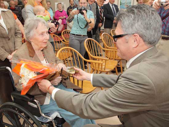Nancy Dunlap receives a bouquet of flowers from Veterans Agent Dennis Lyddy to round out the Veterans Day ceremony. Nancy Dunlap receives a bouquet of flowers from Veterans Agent Dennis Lyddy to round out the Veterans Day ceremony.