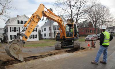 Workers dig a trench down Fairbank Street, just off the Common. (Photo by Lisa Aciukewicz) Workers dig a trench down Fairbank Street, just off the Common. (Photo by Lisa Aciukewicz)