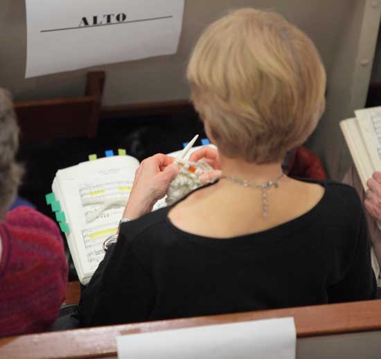 A member of the alto section takes advantage of a lull in the music.