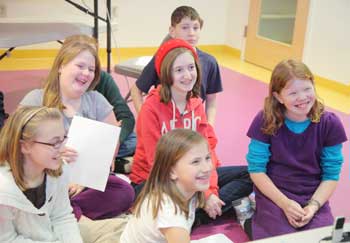 Front row: Book Club participants Chloe Alfieri,  Sophie Beckman, and Jennifer Woolcock.  Middle: Allison Milliken and Gwyneth Evans. Back row: Zach Sclar. (Photo by Lisa Aciukewicz)