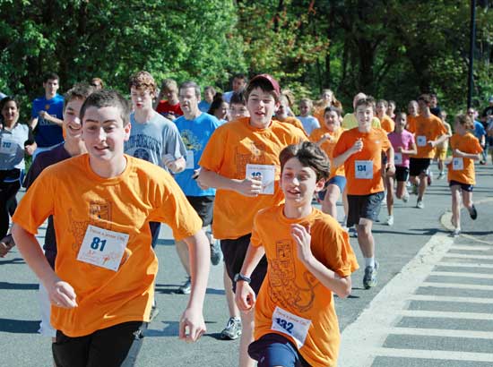 Nadir Hankour and Ezra Kraus lead a pack of runners in the Have a Jessie Day memorial road race, May 21.