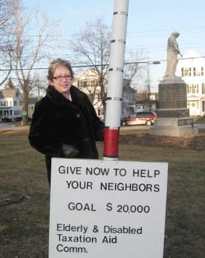 Town Treasurer Debbie Nutter places red tape to mark a new level of donation. (Courtesy photo) Town Treasurer Debbie Nutter places red tape to mark a new level of donation. (Courtesy photo)