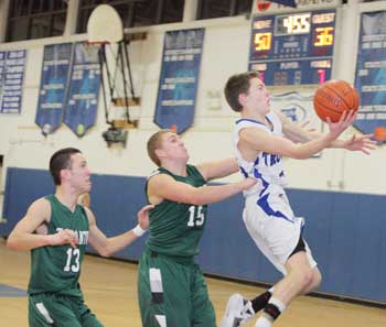 From left: Tahanto’s Sam Perrone and Ryan Belinskas react too late to stop Trevor Granville’s drive to the basket. (Photo by Lisa Aciukewicz) From left: Tahanto’s Sam Perrone and Ryan Belinskas react too late to stop Trevor Granville’s drive to the basket. (Photo by Lisa Aciukewicz)