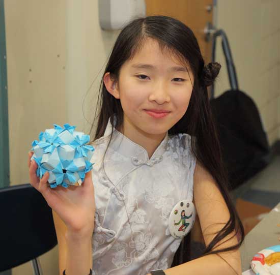 Tsun-Tsun Xue displays her origami creation.