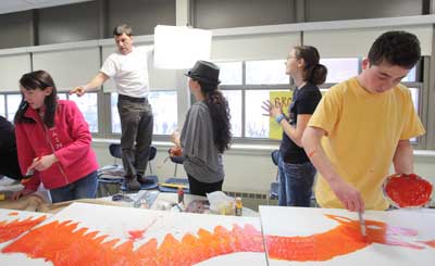 Students from Bromfield Art Club work on a dragon triptych as artist Bruce Davidson provides direction. From left: Elizabeth Armstrong, Bruce Davidson (standing on chair), Bailey Grullon, Lara Schmoyer, and James O’Shea. (Photo by Lisa Aciukewicz) Students from Bromfield Art Club work on a dragon triptych as artist Bruce Davidson provides direction. From left: Elizabeth Armstrong, Bruce Davidson (standing on chair), Bailey Grullon, Lara Schmoyer, and James O’Shea. (Photo by Lisa Aciukewicz)