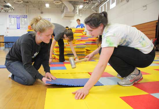  From left: Hannah Porter, Elizabeth Wilkey, and Olivia Maclean work on the dance floor.