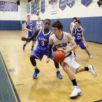 Brian McCullough drives to the basket in a game Monday night against West Boylston. After defeating Hudson, the boys fell to West Boylston 49-42, Feb. 13 at Bromfield.  (Photo by Lisa Aciukewicz)