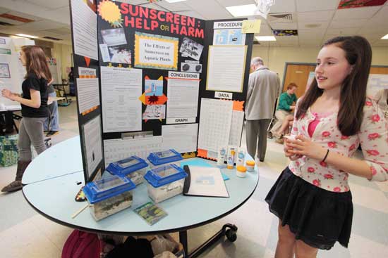 Eighth-grader Katie Erdos wins a Blue Rosette, a  Bare Hill Pond Watershed Management Committee prize, and takes second place in her grade for her study of “The Effects of Sunscreen on Aquatic Plants.”