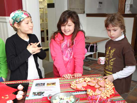  From left, Dharma Cooper, Abigail Boissy, and Elena Junkala enjoy some Valentine goodies.