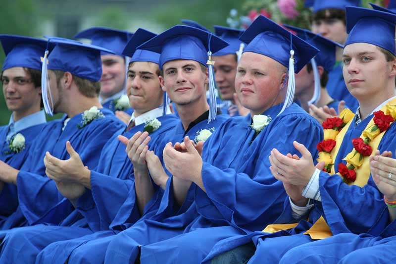 J.P. Messina, Joseph Galeski, Spencer Randall, Rob Williams, Wally Shaw, and Dan Turner clap for their classmates.