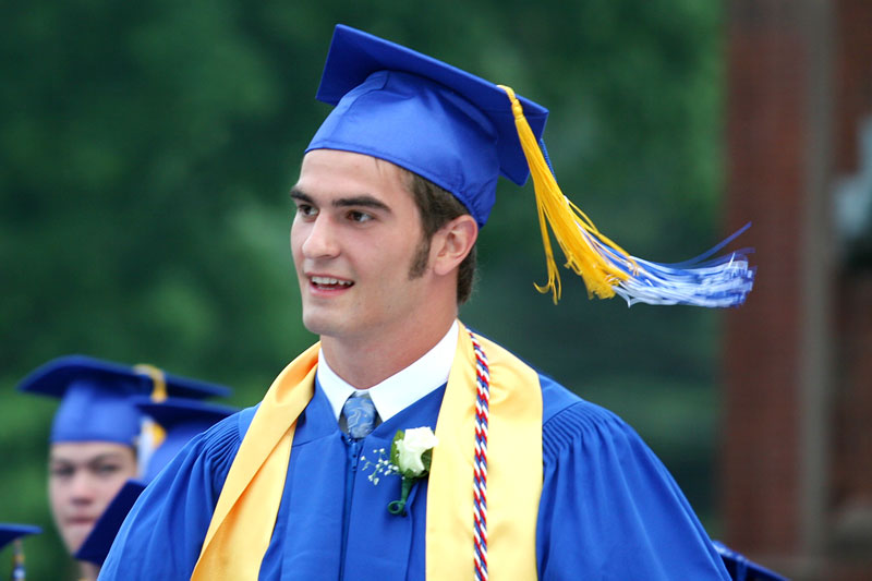 Reed Harasimowicz walks to the podium as he accepts one of several awards.