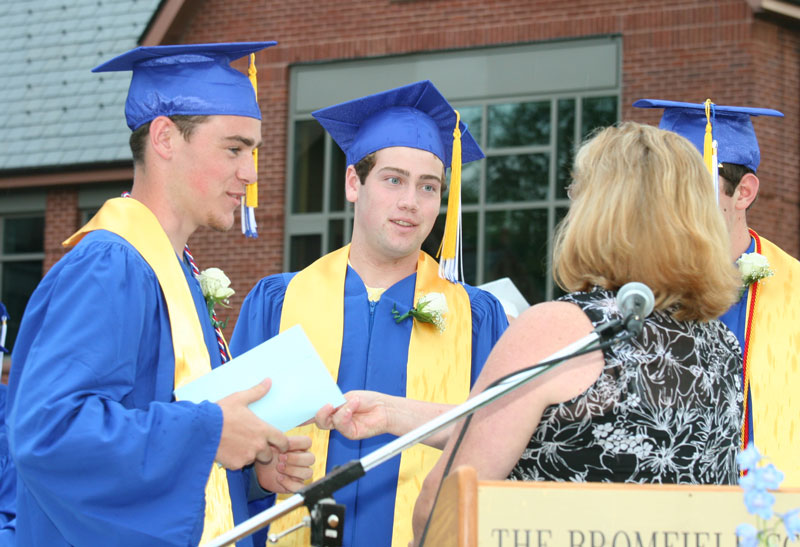 Mike Hulit and Bryan Molinaro accept Harvard Lions Club community awards.