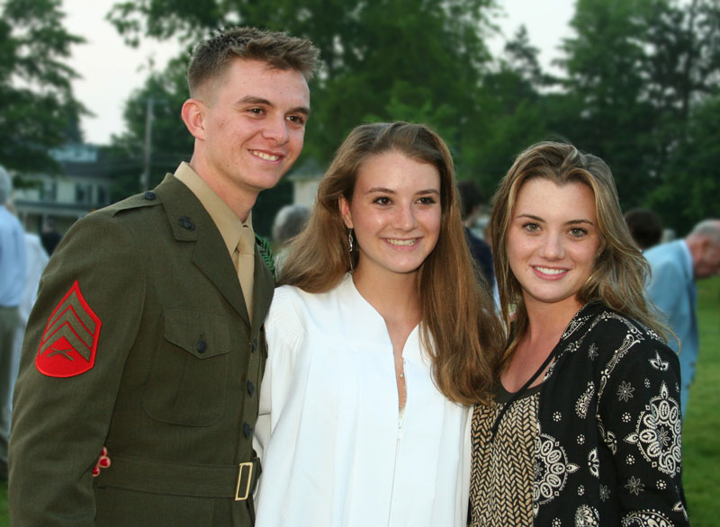 Riana Blinn’s (center) graduation serves as a family reunion as brother Jonathan returns from a four-year stint in the Marines and sister Rachel (right) celebrates her 21st birthday.