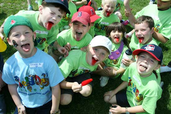 Colin Murphy, Lance Jarosz, Michael Thornton, David Oski, Cormac Day, Victoria Randall, Luke Wharton, and Grace Barton show off their popsicle-stained tongues.