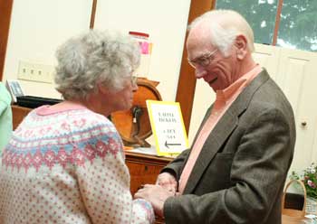 Irene Mannix greets former resident Jim Hamill on the house tour. (Photo by Lisa Aciukewicz)