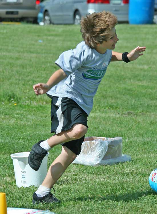 Nick Wyman does his best “crazy dance” as required by a relay race he competes in.