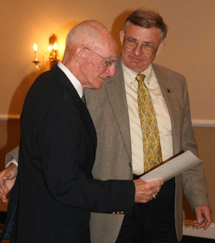 Paul Johnston, left, accepts the Humanitarian Award from Bruce Dolimount. (Courtesy photo)