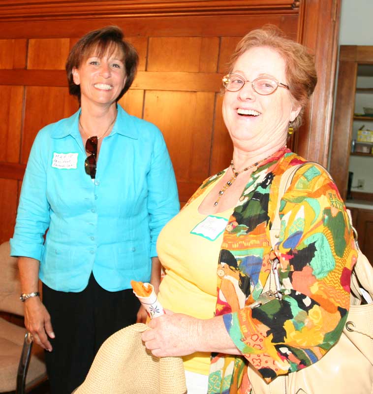 Marie LeBlanc, president of the Friends of the Council on Aging talks with Sue Hildreth, right, about her experiences staying at her grandparents’ house during childhood summers. (Photo by Lisa Aciukewicz)