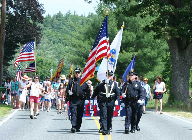 The town police lead the parade.