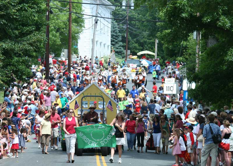 Throngs of spectators swarm Mass. Avenue.