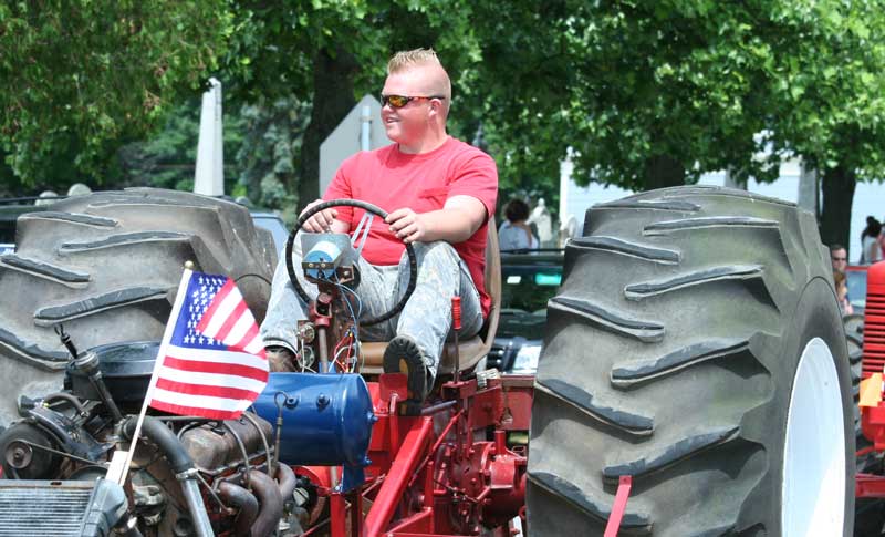 Wally Shaw drives his hot rod tractor in the parade.