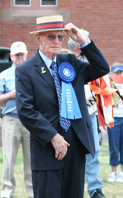 Parade marshal Paul Johnston tips his hat to the crowd.