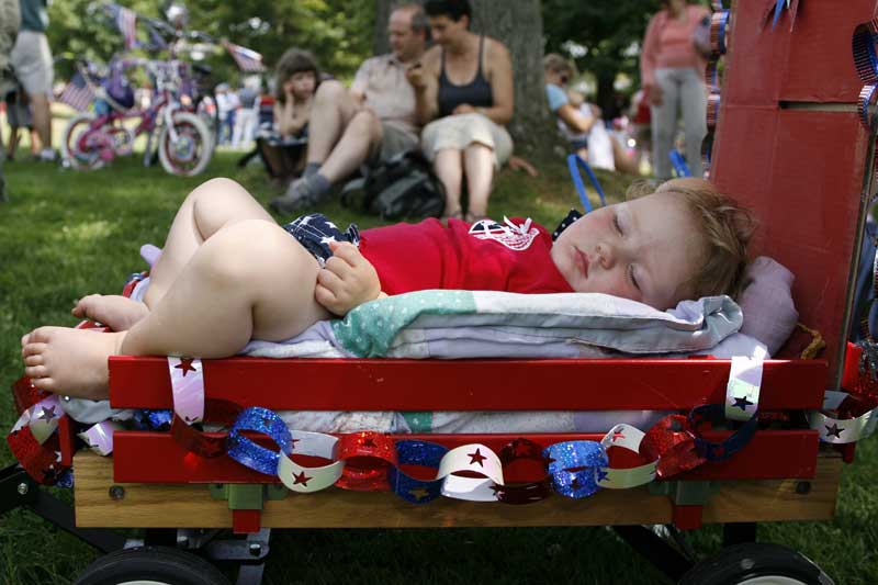 Chloe von Conta, 16 months, of Harvard rests up before the big parade.
