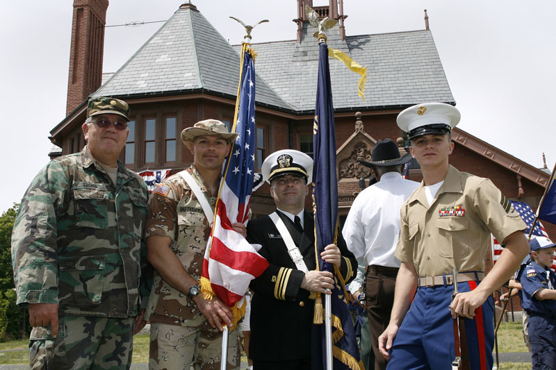Major Steven Cronin, Lieutenant Oleh Dutkewych, Lt. Commander Stephen Dakin, and Sergeant Jon Blinn await the raising of the flag. (Photo by Ellen Harasimowicz)