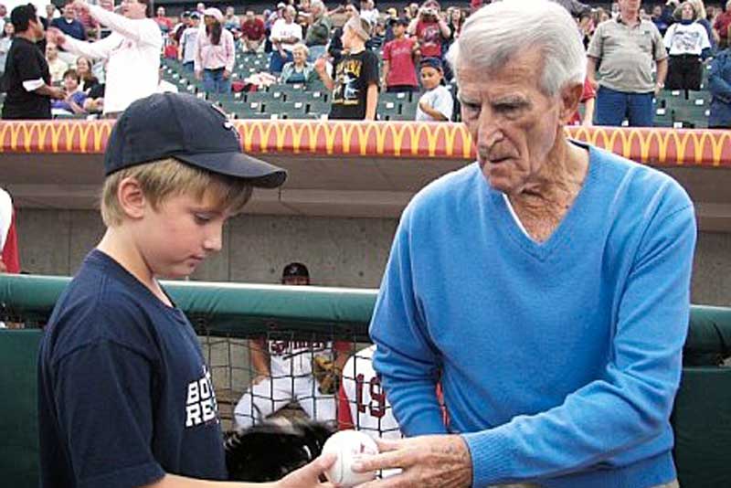 Christopher Culkins receives a signed ball from Red Sox Legend Johnny Pesky. (Courtesy photo) Christopher Culkins receives a signed ball from Red Sox Legend Johnny Pesky. (Courtesy photo)