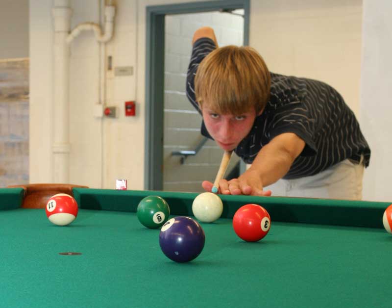 Mike Girard breaks in the new pool table. (Photo by Lisa Aciukewicz) Mike Girard breaks in the new pool table. (Photo by Lisa Aciukewicz)