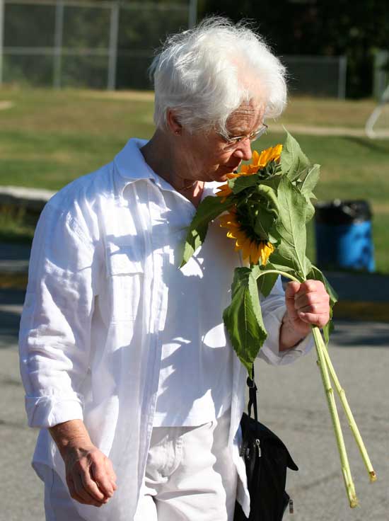 Joanne Williamson enjoys some freshly picked sunflowers. 