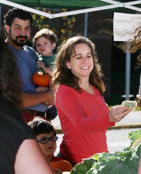 Jonathan, Merlin, Forrest, and Marcie Feist make their purchases.