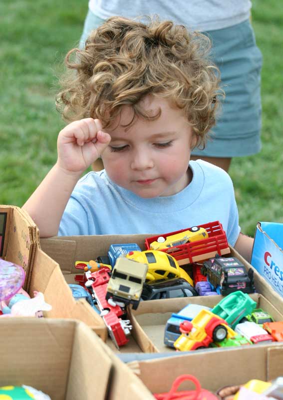 Alec Villian admires the toy cars.