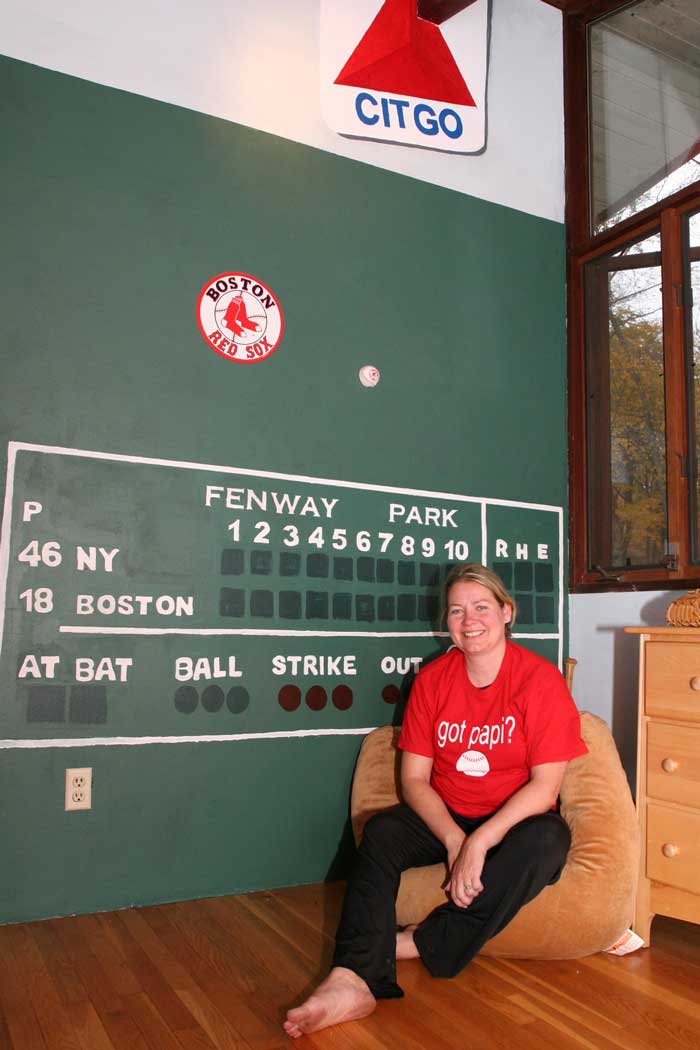 Muralist Donna Lee sits by the big Green Monster she created in her son Alex’s bedroom. (Photo by Lisa Aciukewicz) Muralist Donna Lee sits by the big Green Monster she created in her son Alex’s bedroom. (Photo by Lisa Aciukewicz)