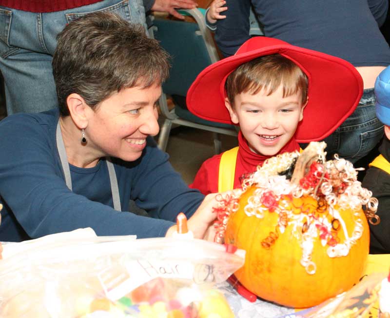 Risa Goldman and son Sawyer make a curly-headed pumpkin.