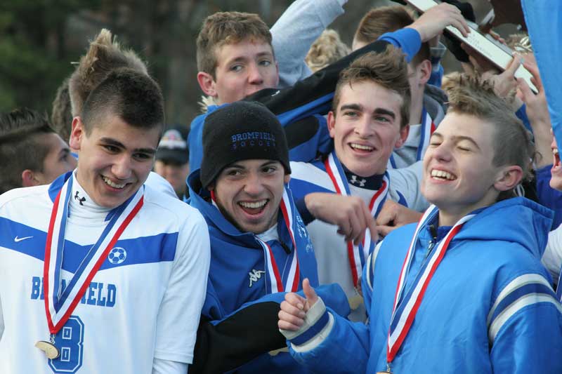 Bromfield soccer team members celebrate after their victory. Left to right are Salim Al-Holmsi, Nick Kimball, Connor MacKenzie, and Matt Jones. In back is Jon Alexander.