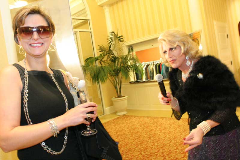 Looking “mahvelous,” Lynne Bourgeois is interviewed by Joan Rivers impersonator Joe Posa.