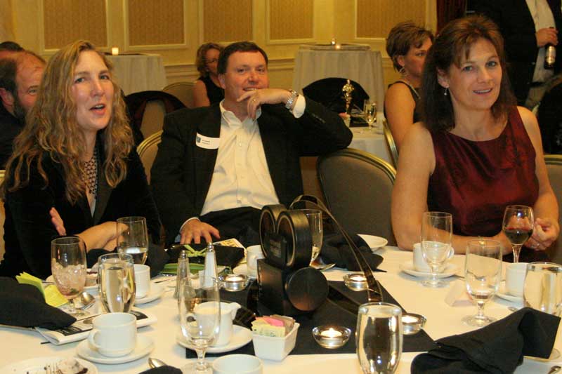 PTO co-President Andrea Hill, Frank Noyes, and PTO co-President Cathryn Noyes relax after dinner.