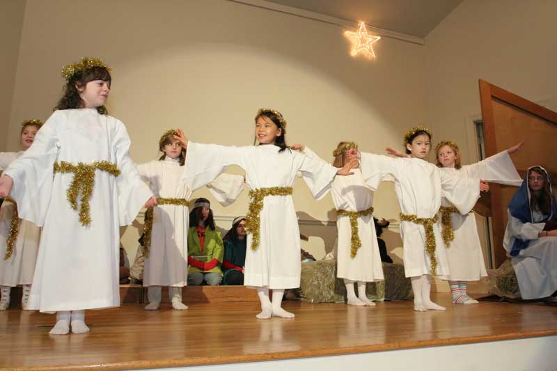 Angels Kelly Pickreign, Jessika Antinori, Cameron Hettich, Helene Mantineo, Julia Foley, and Sadie Flannagan dance as Mary (Alice Kennedy) looks on.