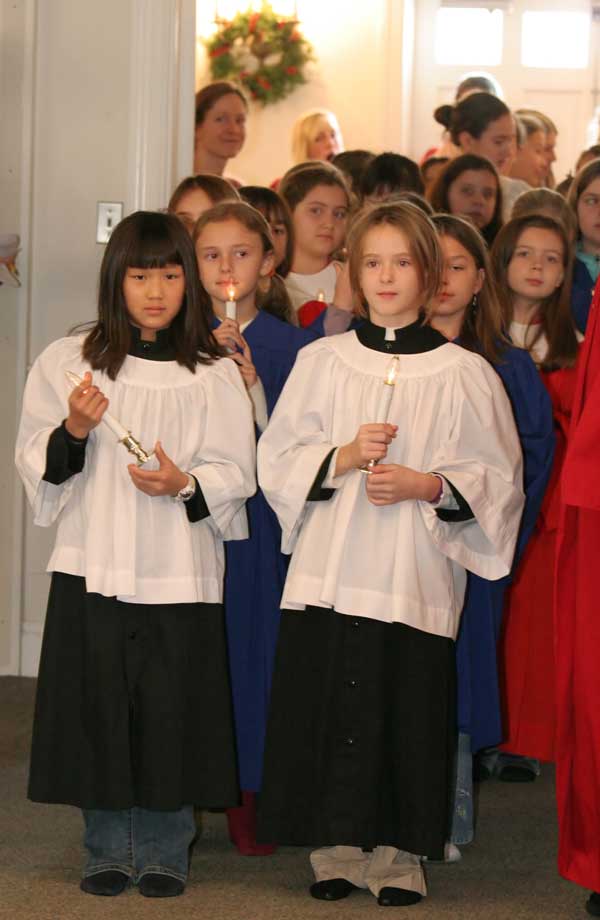 Choir members Stacey Nelson, Rebecca Nickerson, Brigette Lewis, Deirdre Kennedy, Liza Agosta, and Grace Barton gather in the doorway.