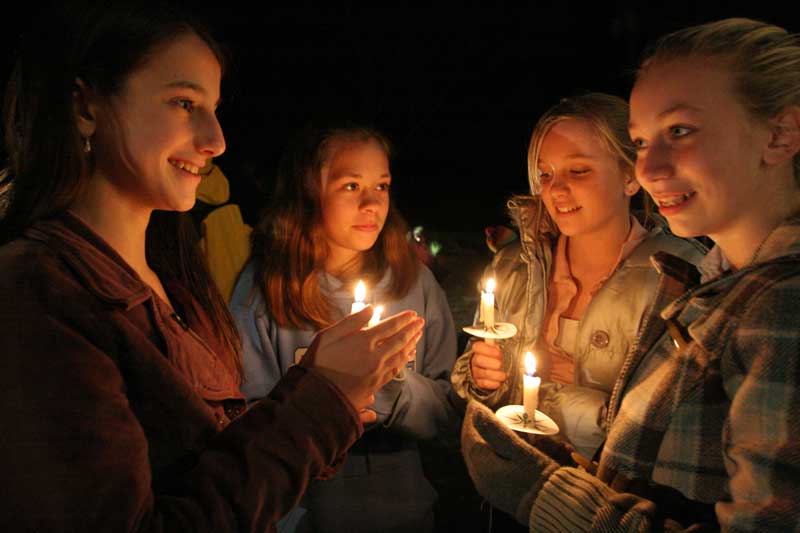 Kaitlin Marksteiner, Sarah Duckett, Miranda DeGuglielmo, and Fiona Shay visit by candlelight.