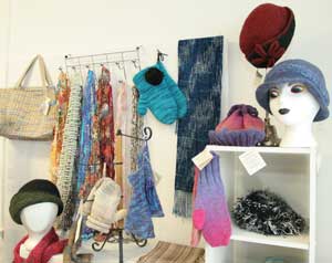 In addition to exotic knitting, crocheting, and weaving materials, The Fiber Loft sells many unique finished products. (Photo by Lisa Aciukewicz) In addition to exotic knitting, crocheting, and weaving materials, The Fiber Loft sells many unique finished products. (Photo by Lisa Aciukewicz)