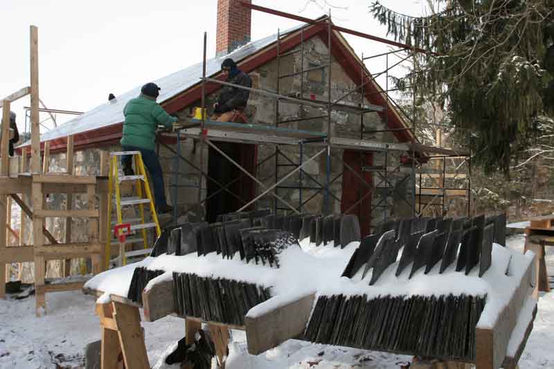 Slate shingles await their return to the roof of the Shaker herb drying house. (Photo by Lisa Aciukewicz) Slate shingles await their return to the roof of the Shaker herb drying house. (Photo by Lisa Aciukewicz)